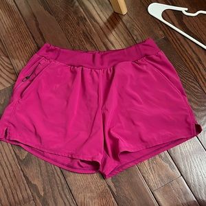 magenta running shorts